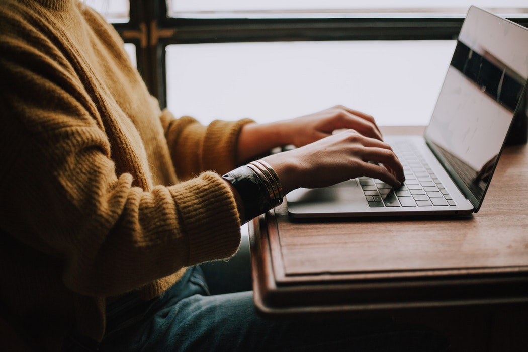 A woman on her laptop.